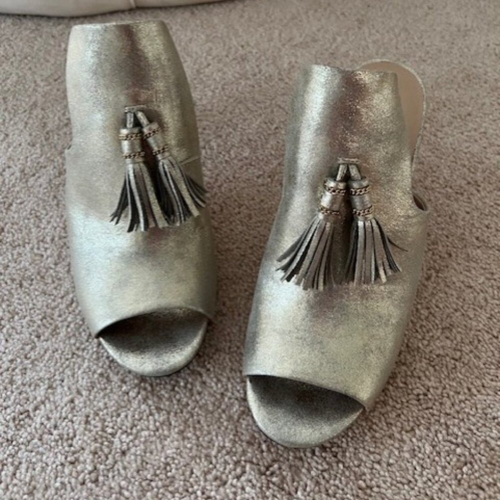 Karl Lagerfeld Gold heels with tassel.